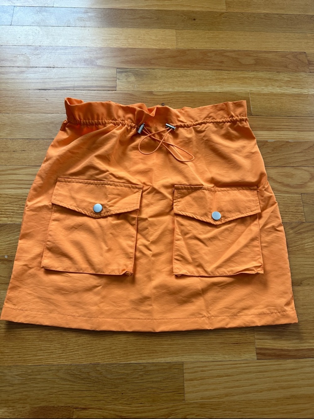 NWT/ Size-Small- Bright Orange mini skirt/ wind breaker like material